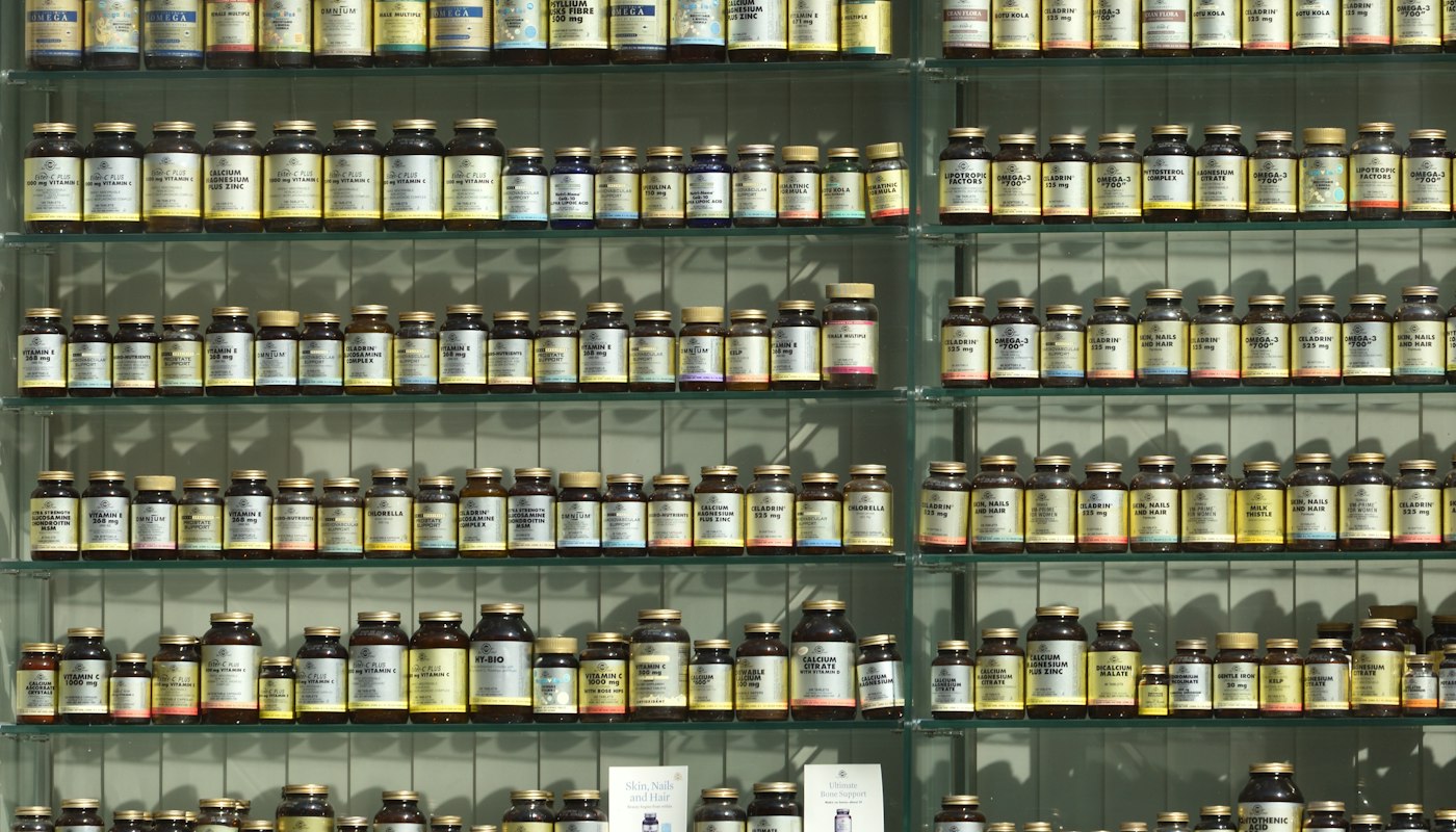 Quality control specialist checking natural health product labels for compliance